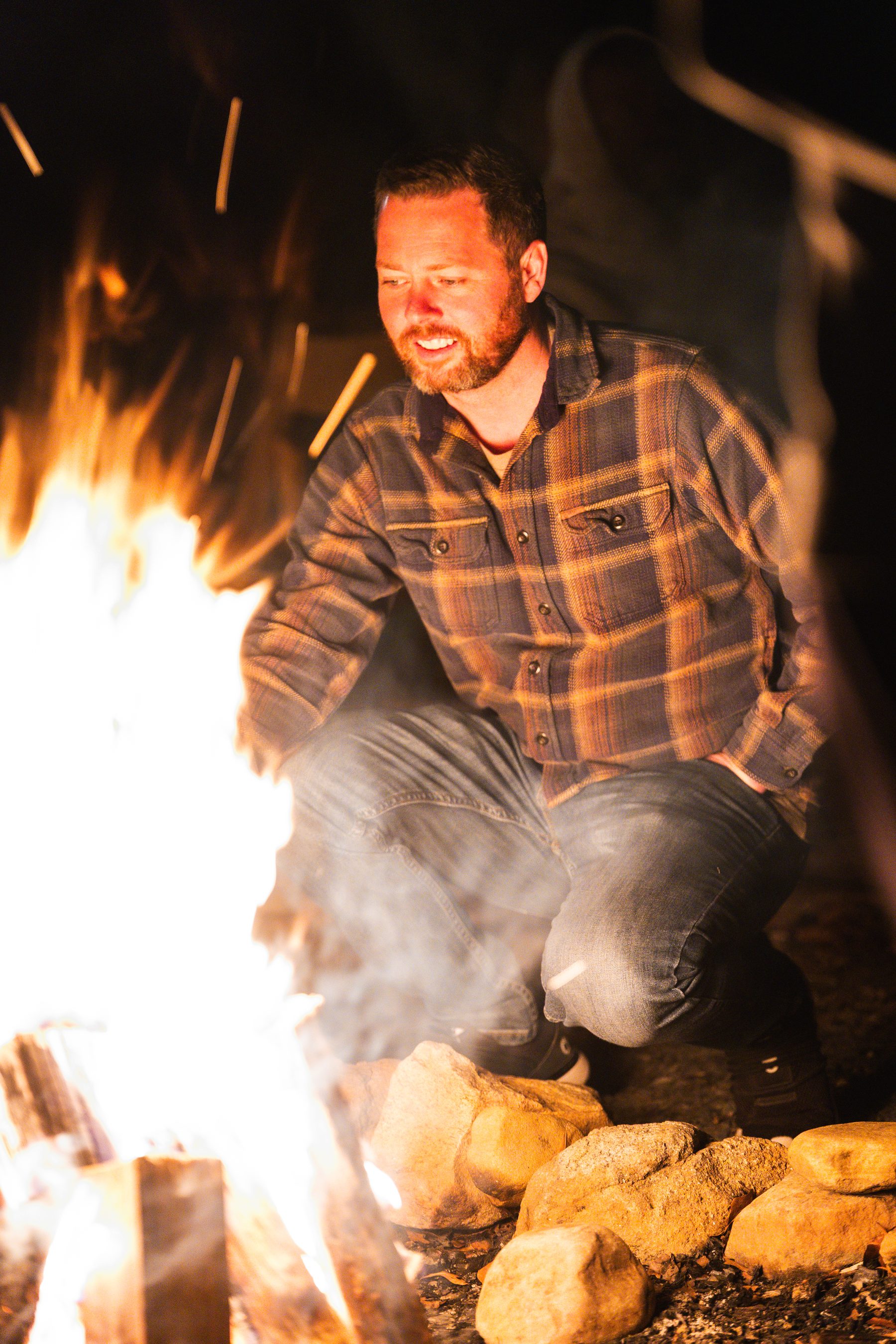 Growth Summit attendees connecting around a fire